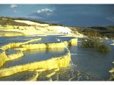 Hierapolis - the Pamukkale (`cotton castle`) made of lime deposits in the hot water pools.